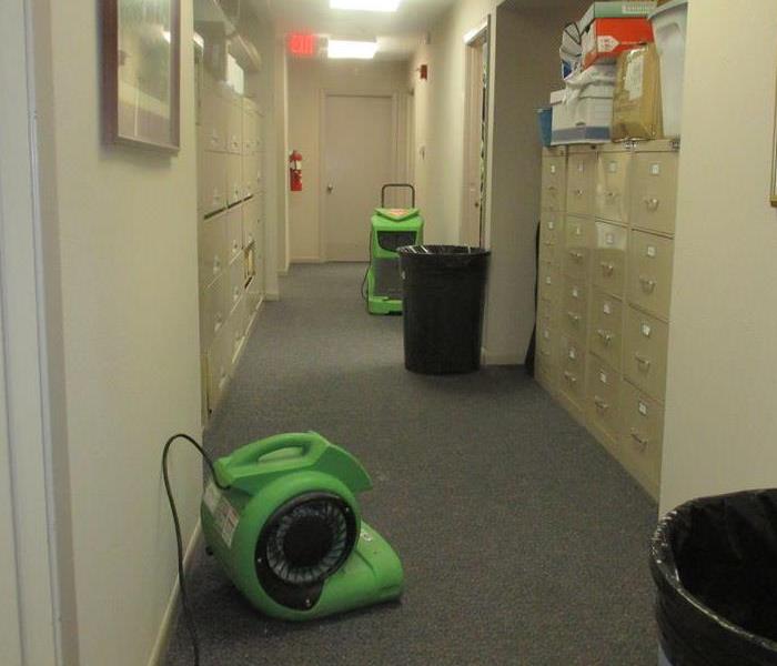 Drying equipment set up in a hallway.